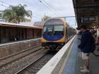 Train headed for Sydney arriving at the Wollongong Station