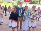 Getting a picture with members of the Mazahua community in their traditional dresses