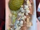 Here's a traditional pickled herring with pickles and onions! These also come in sandwich form