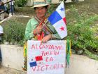 A Panamanian from the Ngäbe-Buglé Comarca carries a sign at an anti-mine protest that says "Finally, we achieved victory" 