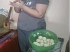 My husband’s cousin Claudia rolls masa (corn dough) into balls to make tortillas.