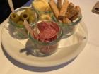 A delicious charcuterie board served in the train's restaurant car