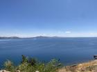 The deep blue color of Lake Titicaca and the sky above