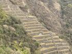 Tens of stone terraces located hundreds of meters below the mountain's summit