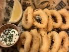 Calamari (fried squid) is a common snack served with lemon and an aioli