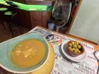 The start of a traditional menu del dia: a vegetable soup and some olives