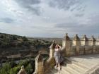 Me on top of the Castle of Segovia, north of Madrid. You can see the lush, green landscape in the background.