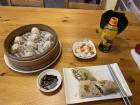 Soup dumplings and duck burrito paired with seasonal vegetables