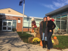In front of Agnor Hurt Elementary School with Mrs. Shand during an annual visit while in High School