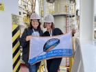 Tessa and Larkin with the expedition flag