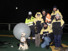 The team with our "Antarctic dog" doing a balloon launch
