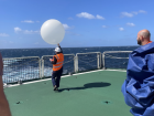  Kelsey launching one of the first balloons on the voyage!