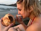 Eating fresh coconuts at the beach