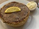 This delicious bun is served with a side of clotted cream