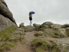 This is me on the top of the rocks at Dartmoor, trying to stay dry!