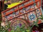 Traditionally painted oxcart wheel on the way to Puntarenas