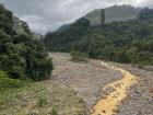 The buses in Costa Rica have to drive through all sorts of different landscapes, including this muddy river!