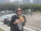 Here I'm enjoying a cheese empanada while I walk around a park in Quito