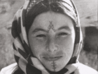 An Amazight woman with traditional face tattoos 