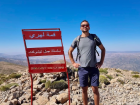 Houssaine on top of the tallest summit in the Middle Atlas Mountains 