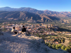 My friend and I sitting on the mountain looking down at our town