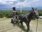 A statue of Juan Valdez (a famous coffee character in Colombia used to promote the Juan Valdez coffee brand/chain)