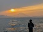 Fisherman and Mt. Fuji in the back with the sun beginning to set