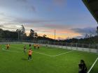 Some people playing soccer on a privately-owned turf field in my town