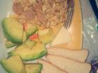 A typical Belizean dinner: scrambled eggs with sausage, sliced bread, soft white cheese and avocado