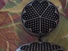 A waffle iron shows its interesting pattern. What does the shape look like to you?