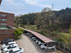 The view outside my classroom window; almost all the cars in Korea are white or black! 