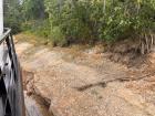 The boat docks by driving into the sediment on the river bank and tying to a tree