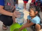 Here I am helping young children with clean water access in their communities