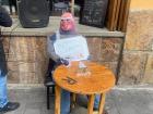 An "Año Viejo" doll outside of a popular breakfast restaurant, enjoying his "last meal"!