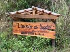 A sign on a hiking trail that says "Welcome" in English, Spanish and Kichwa, reflecting the diversity of language in Ecuador!