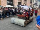  A family dressed as the Flintstones taking part in the wooden car race!