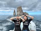 My mom and I in front of Kicker Rock, or Leon Dormido, where we had just seen a large group of hammerhead sharks while snorkeling