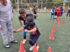 In this soccer activity designed to practice positive communication, a partner has to use assertive communication to guide their blindfolded partner through an obstacle course