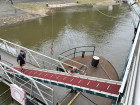 Krista: To leave the boat, we need a gangway. So each time we arrive in a new place, the crew puts the gangway in place for us. It takes a small crane and a few crew members to secure it