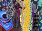 The women have a dance break during food prep for a wedding celebration. Men typically do not dance in Pulaar culture. 