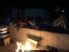 My host parents fall asleep under blankets next to the fire. As Senegal is extremely hot most of the time, our family loves to get bundled up when it dips below 75 degrees.