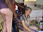 My host sister Koumba gives me my first (and last) set of cornrows. Teenagers will often sit around in the afternoons taking turns braiding each other's hair. 