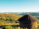 The Lesotho landscape with a rondoval house