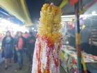 "Elotes locos" ("crazy" corn on the cob) is one of the popular snacks sold at the carnival. It is seasoned with mayonnaise, ketchup and cheese