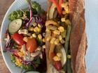 Vegan sandwich and a delicious salad to eat while doing homework at a cafe