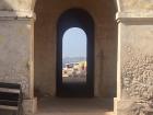 Looking through a door on the Island of Goree to see the vibrant city of Dakar