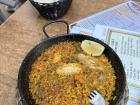 Traditional "paella" dish with rice, chicken, beans, tomatoes and green beans 