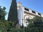 Some orange trees in front of a church in downtown Seville