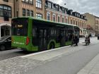 Green Bus stopping to pick up passengers