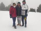 Andres and his mom and older brother playing in snow